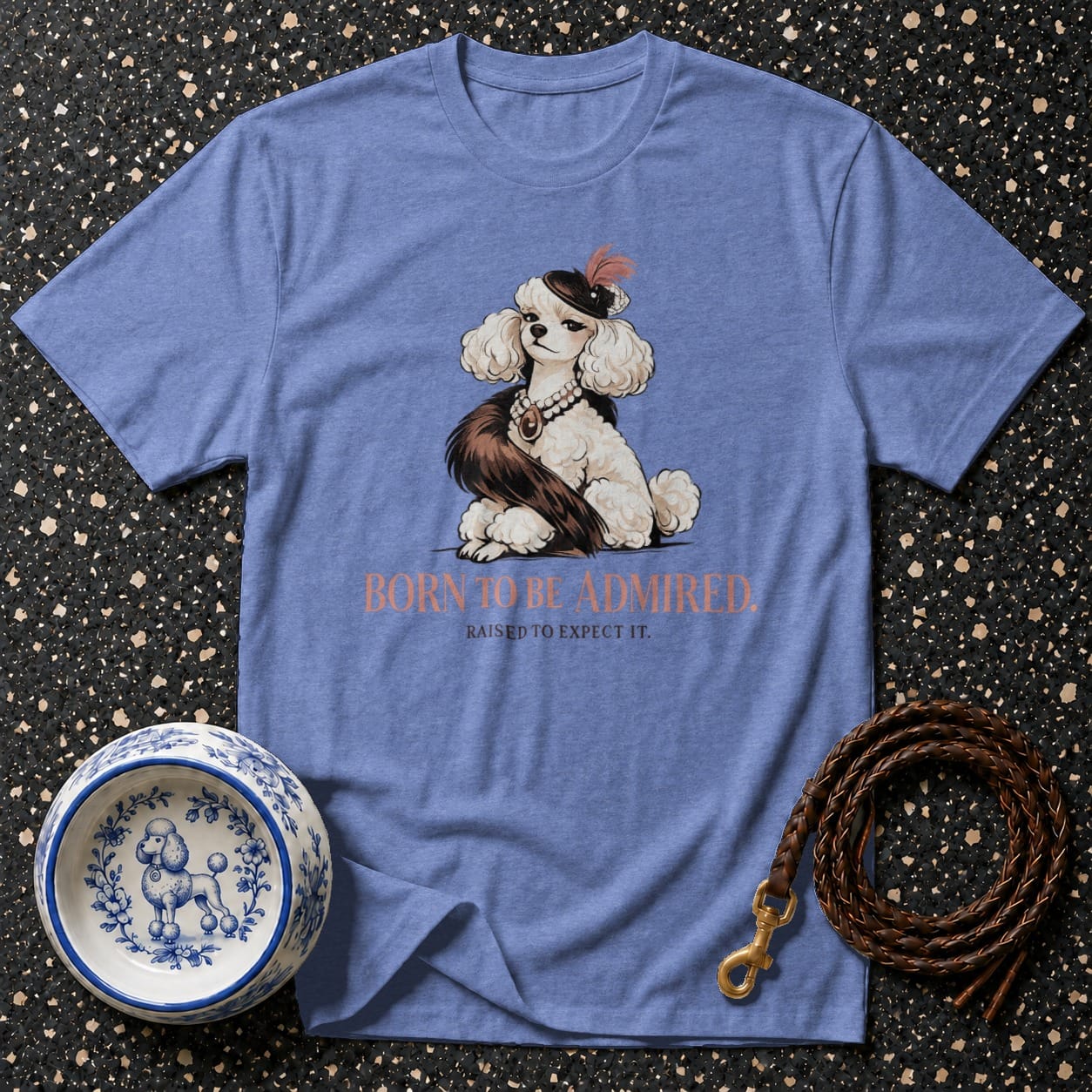 Blue t-shirt with a poodle illustration and text "BORN TO BE ADMIRED."