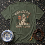 Green t-shirt with vintage graphic of a poodle, nature scene, and text.