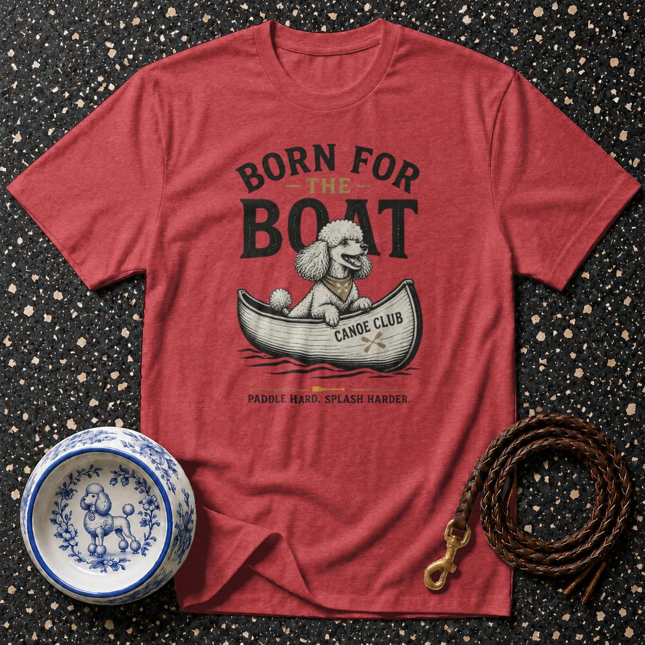 Red t-shirt with "Born for the Boat" graphic featuring a poodle in a canoe named "Canoe Club".