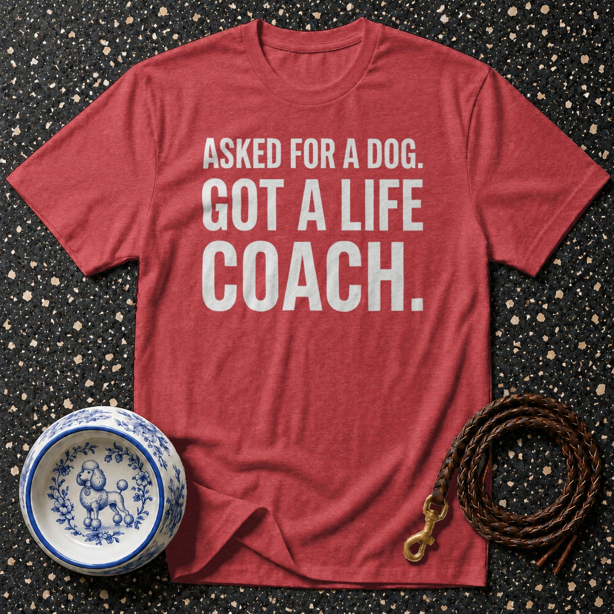 Red t-shirt with white text saying "ASKED FOR A DOG. GOT A LIFE COACH."