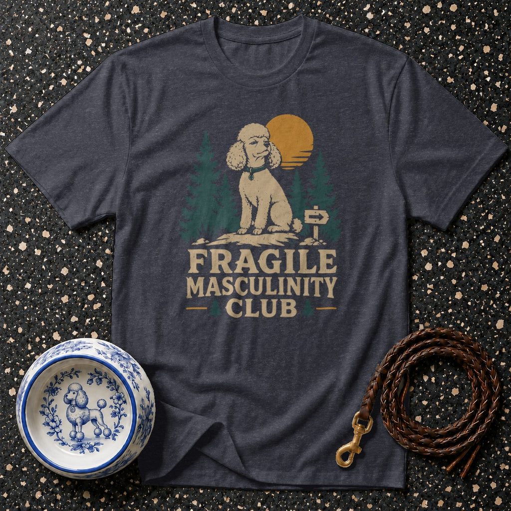 T-shirt with a poodle sitting in a forest scene and text "FRAGILE MASCULINITY CLUB".