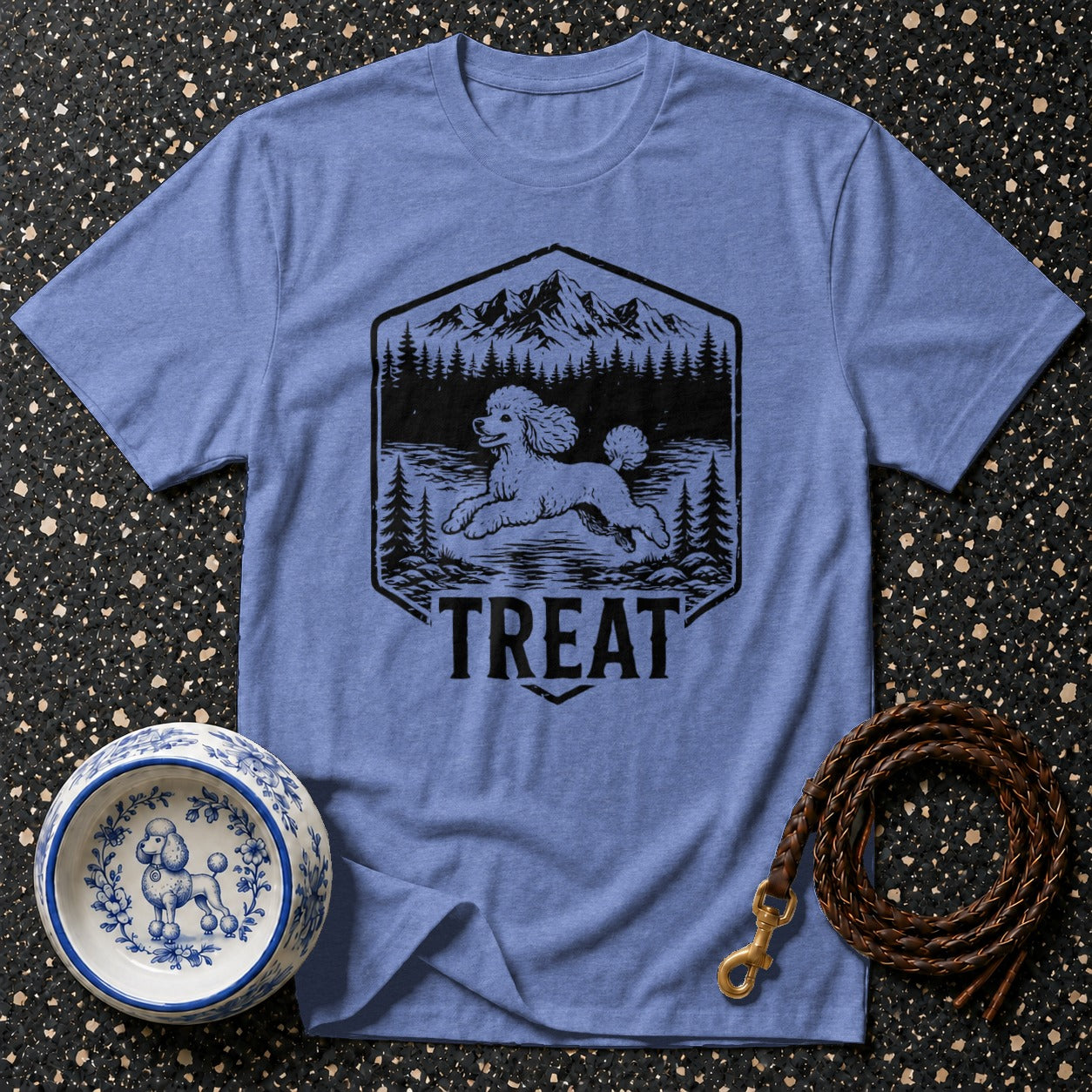 T-shirt with poodle, mountains, trees, and the word TREAT printed on it.