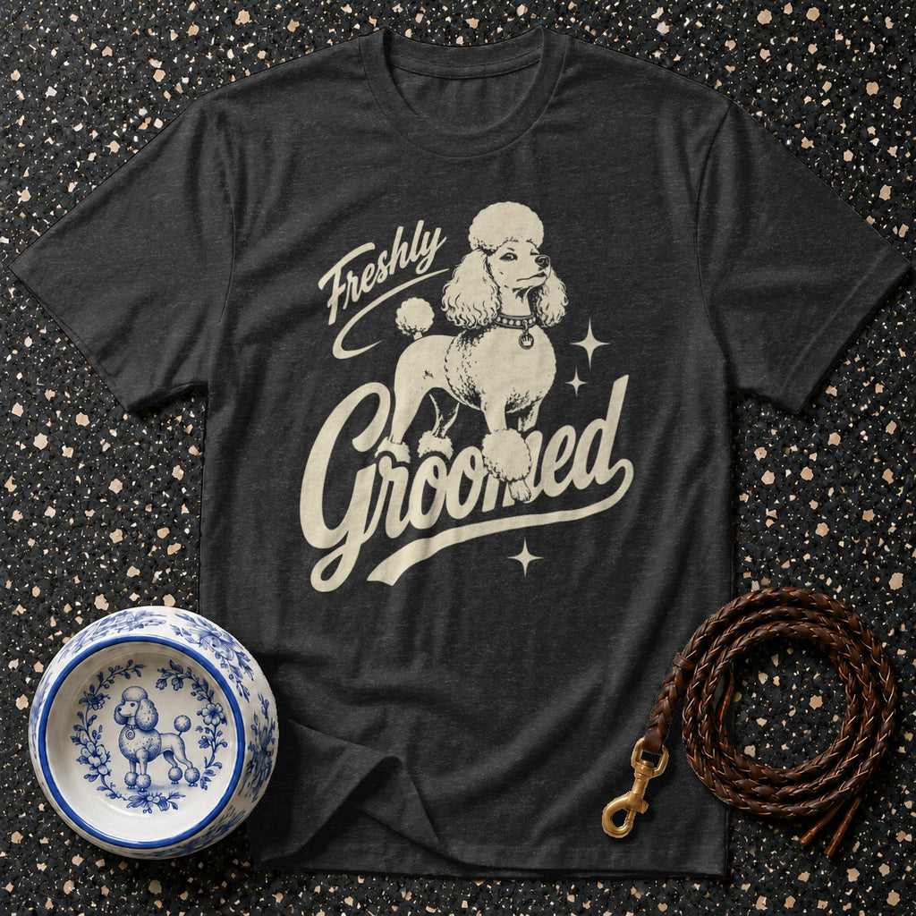 Dark grey t-shirt with a poodle graphic and "Freshly Groomed" text.