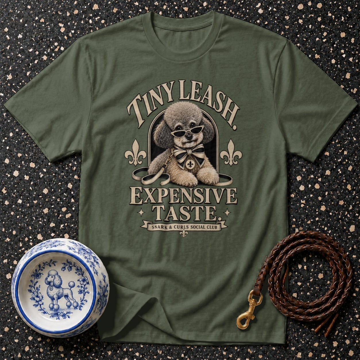 Green t-shirt with poodle graphic and text "Tiny Leash Expensive Taste".