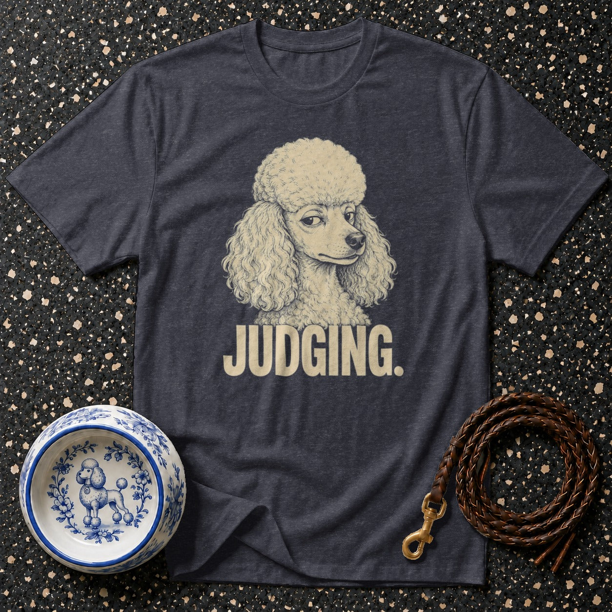 Dark t-shirt with a poodle illustration and the text "JUDGING."