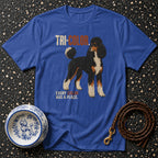 Blue t-shirt with tri-color poodle graphic and text "TRI-COLOR. EVERY HAS A PLACE."
