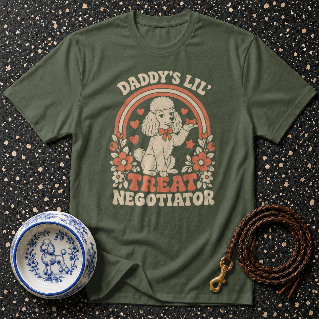 Green t-shirt with "Daddy's Lil' Treat Negotiator" text and poodle graphic.