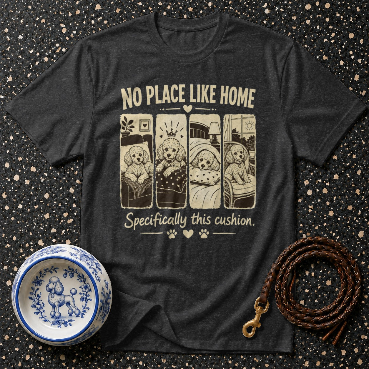 Dark gray t-shirt with four poodle illustrations and text: "NO PLACE LIKE HOME. Specifically this cushion."