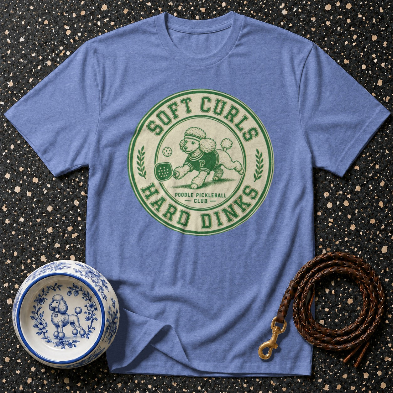 Blue t-shirt with green "Soft Curls Hard Dinks Poodle Pickleball Club" dog graphic.