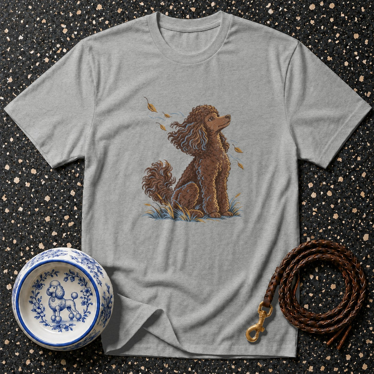 Grey t-shirt with brown poodle illustration, dog bowl, and leather leash.