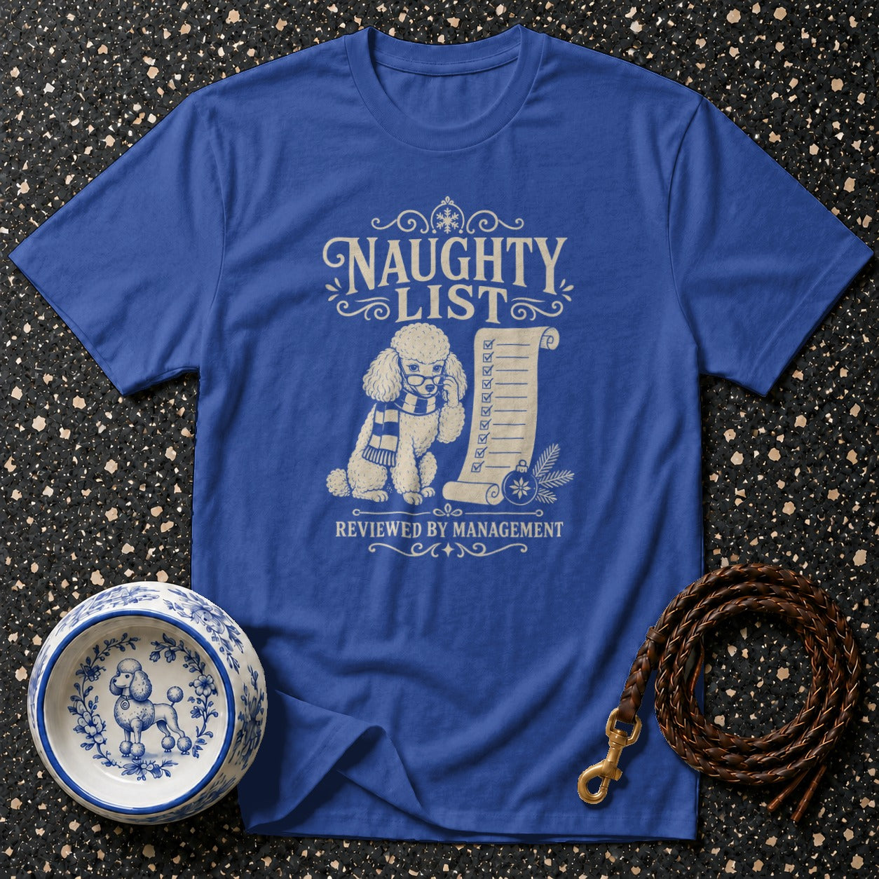 Blue t-shirt with poodle on naughty list with checks and "reviewed by management" text.