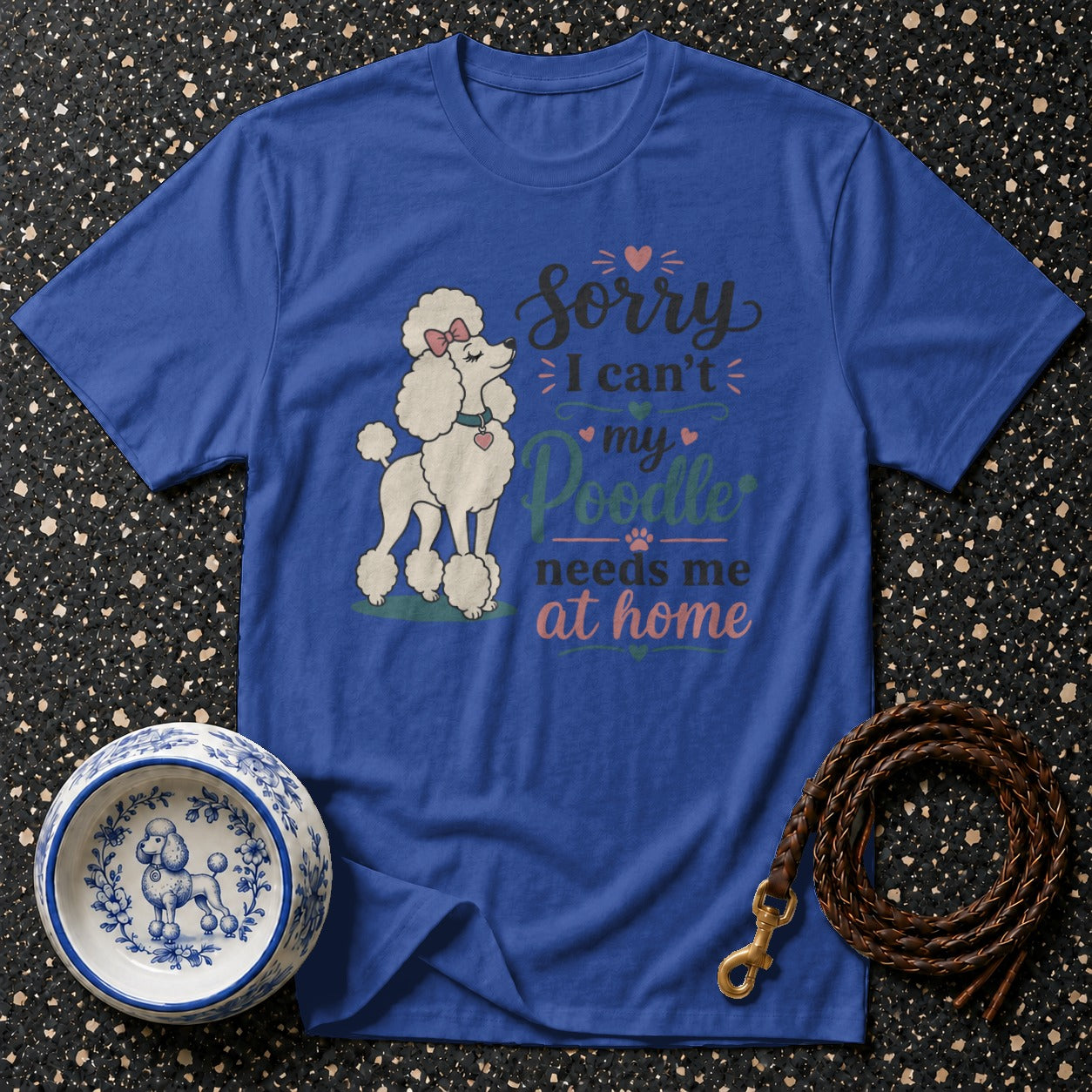 Blue t-shirt with a white poodle and "Sorry I can't my Poodle needs me at home" text.