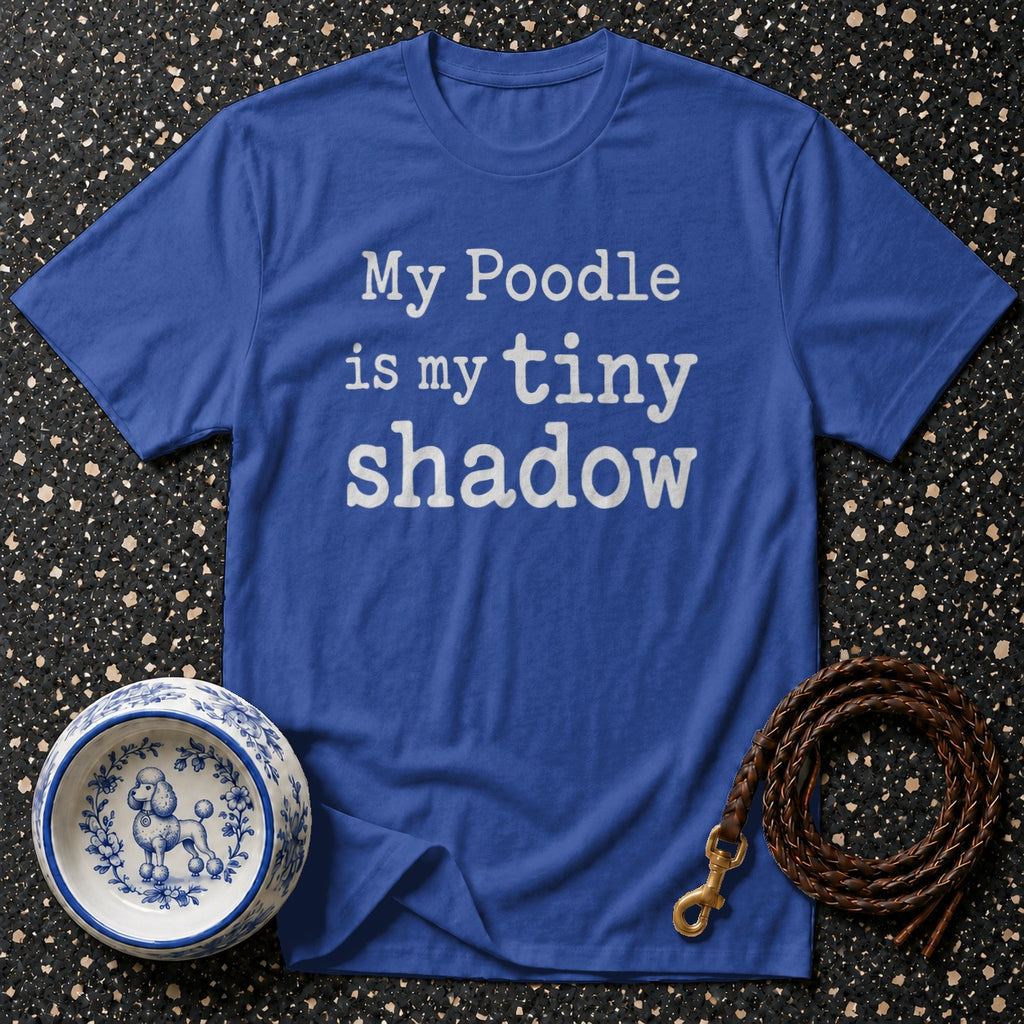 Blue t-shirt with white text "My Poodle is my tiny shadow" and dog bowl.