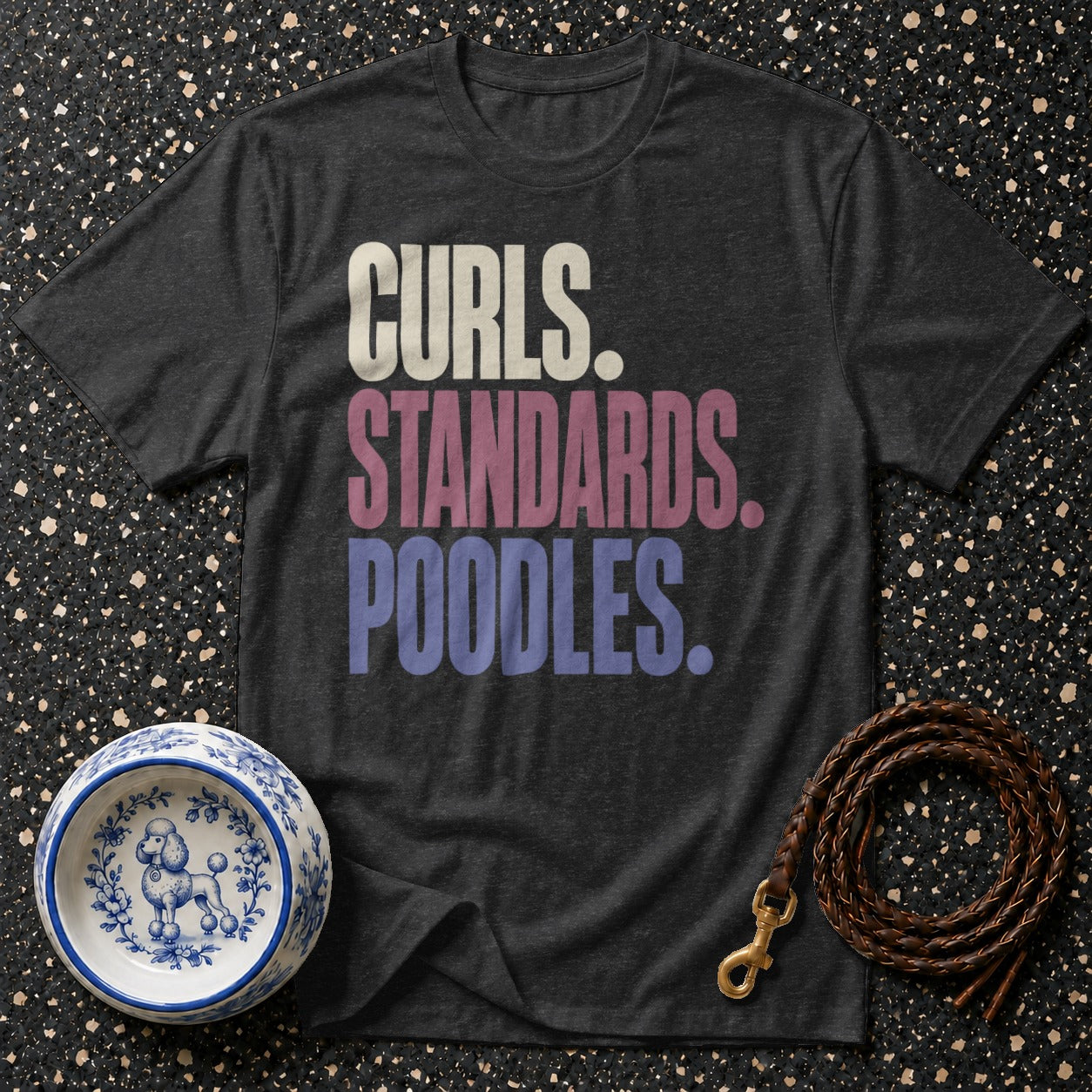 Dark t-shirt with text "Curls. Standards. Poodles." and a poodle dog bowl.