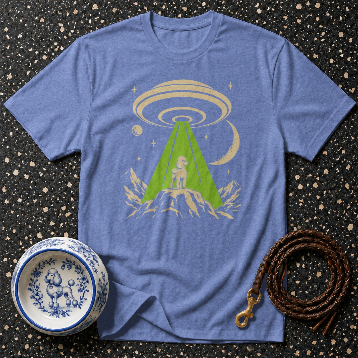 Blue t-shirt with a poodle on a mountain under a UFO beam.