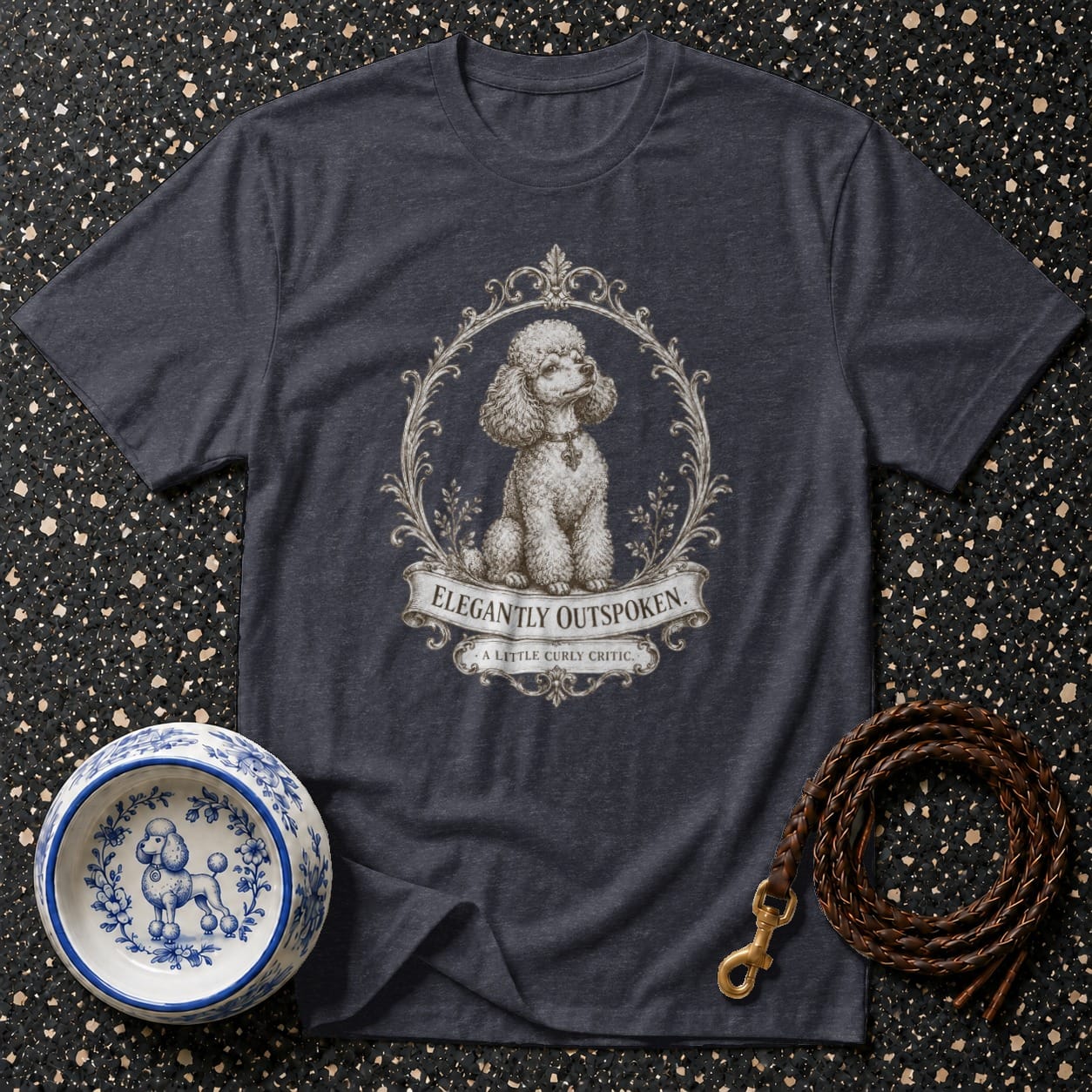 Dark heather t-shirt with poodle illustration and "Elegantly Outspoken" text.