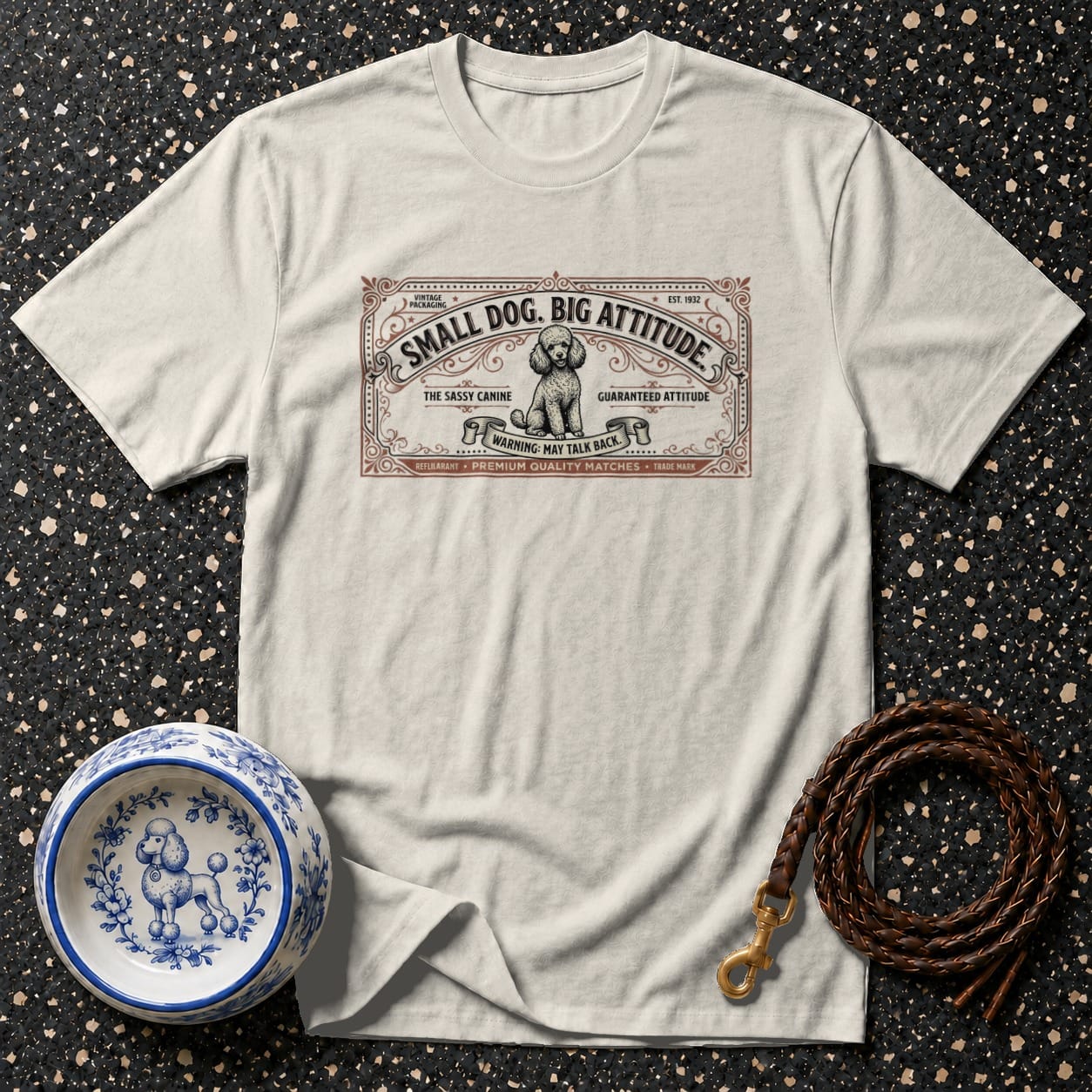 Cream t-shirt with "Small Dog. Big Attitude." text and a poodle illustration.
