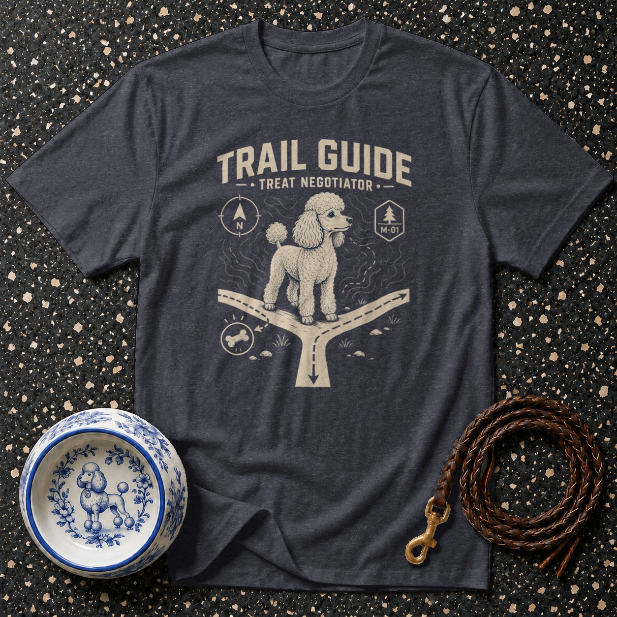 Grey t-shirt with a poodle wearing a leash, standing at a crossroads, with text "Trail Guide Treat Negotiator."