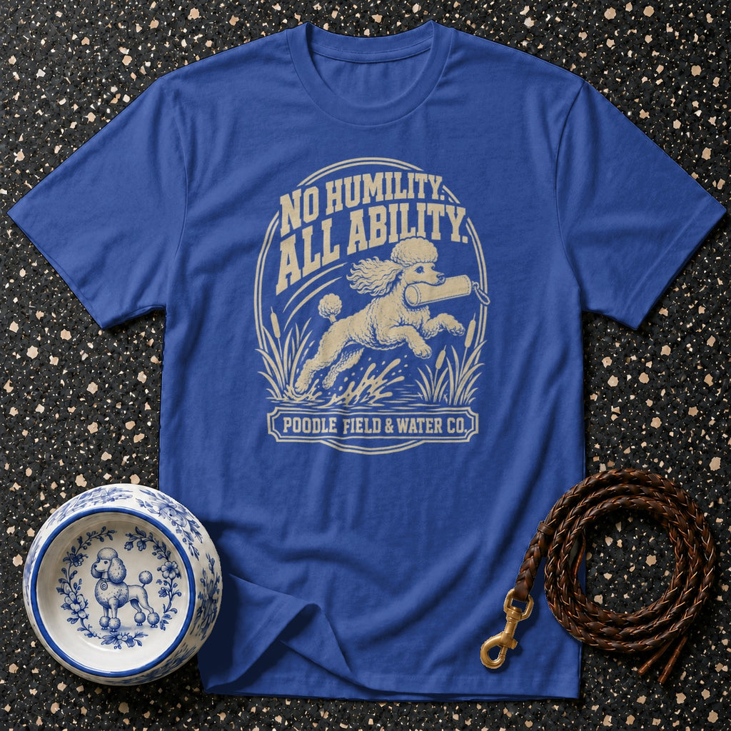 Blue t-shirt with a cream graphic of a poodle running with a retrieve dummy.