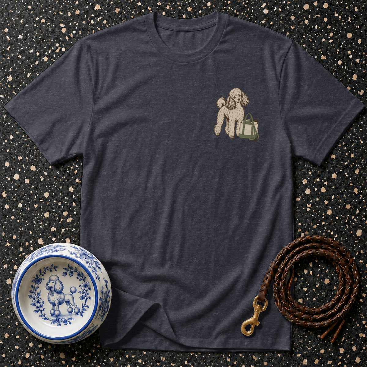 Dark grey t-shirt with embroidered poodle and bag design on chest.