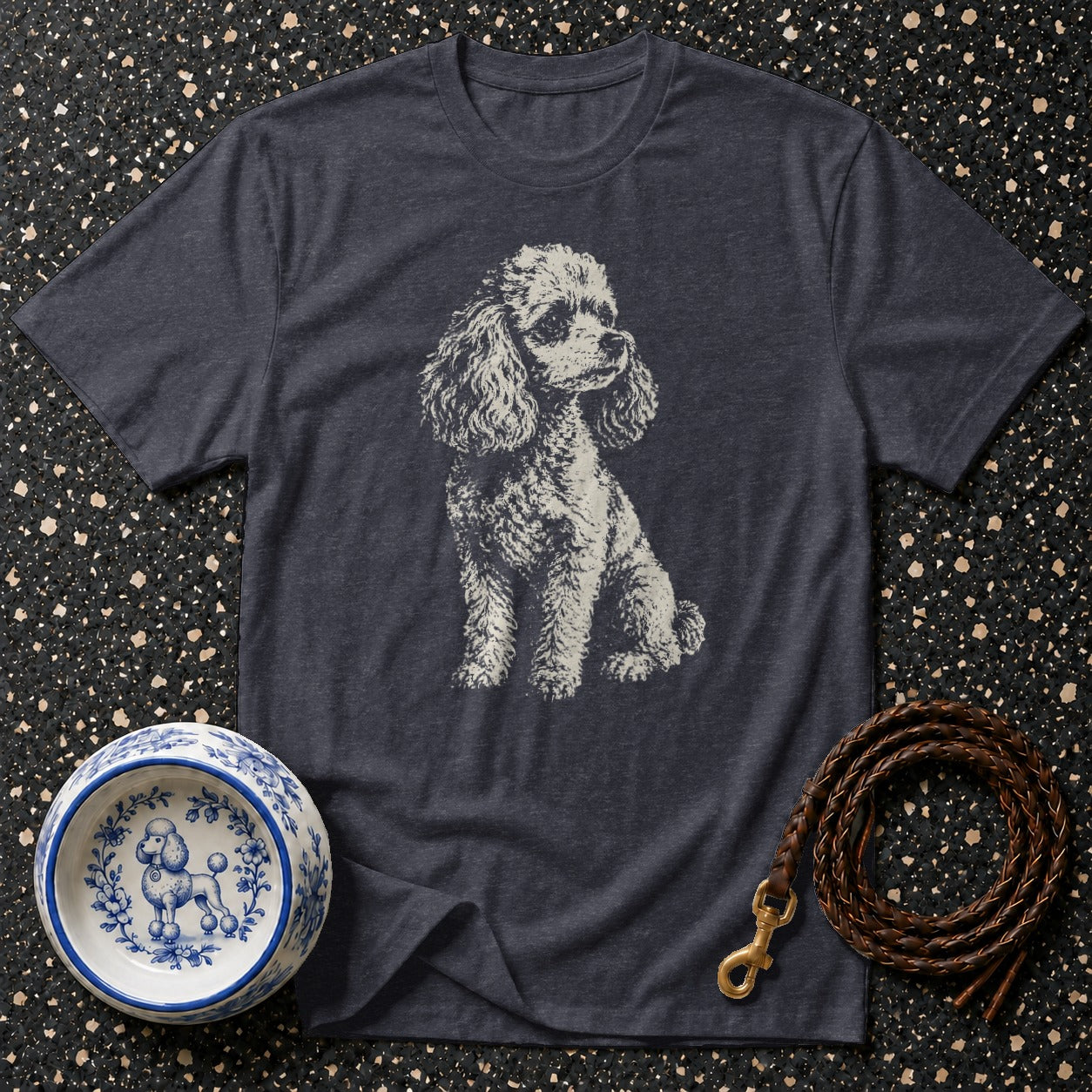 Dark grey t-shirt with a sketched poodle graphic, dog bowl, and leather leash.