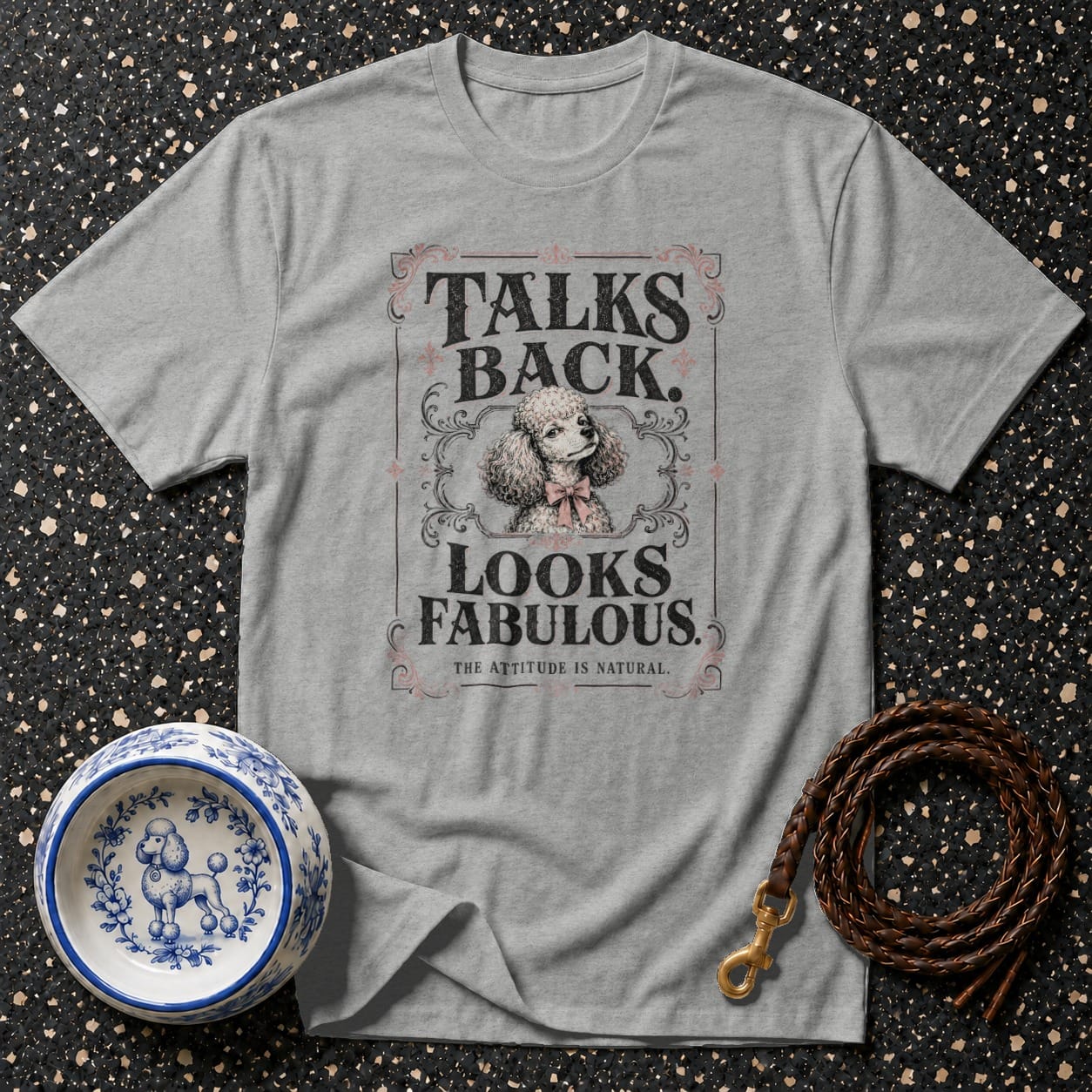 Grey t-shirt with "Talks Back. Looks Fabulous." text and a poodle illustration.