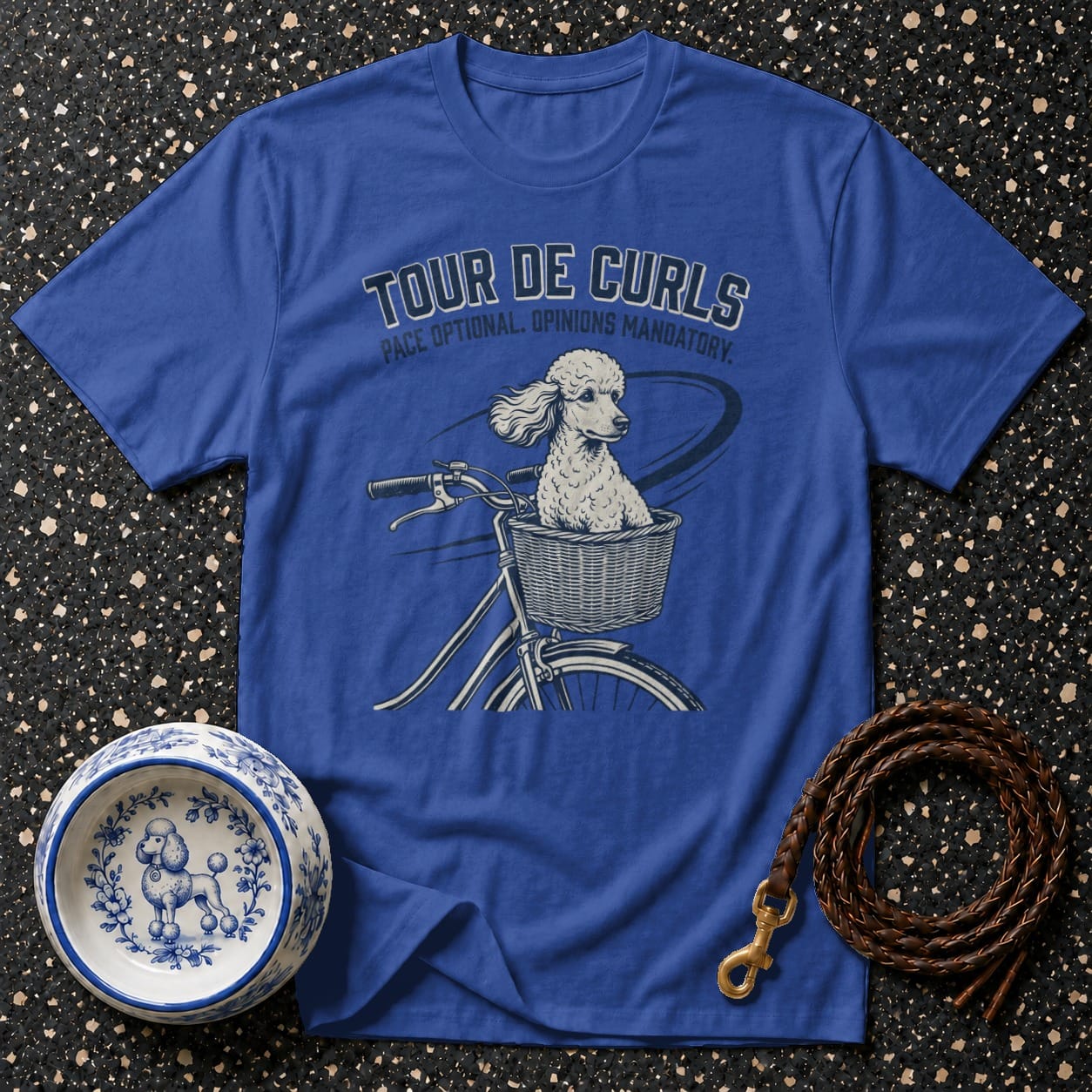 Blue t-shirt with "Tour de Curls" and poodle on a bicycle graphic.
