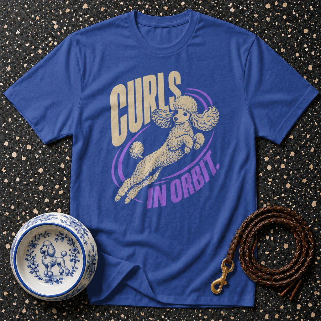 Blue t-shirt with poodle graphic and text "CURLS IN ORBIT"