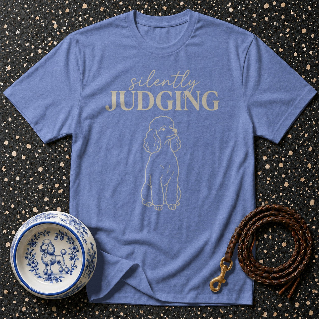 Blue t-shirt with cream text "silently JUDGING" and a poodle outline.