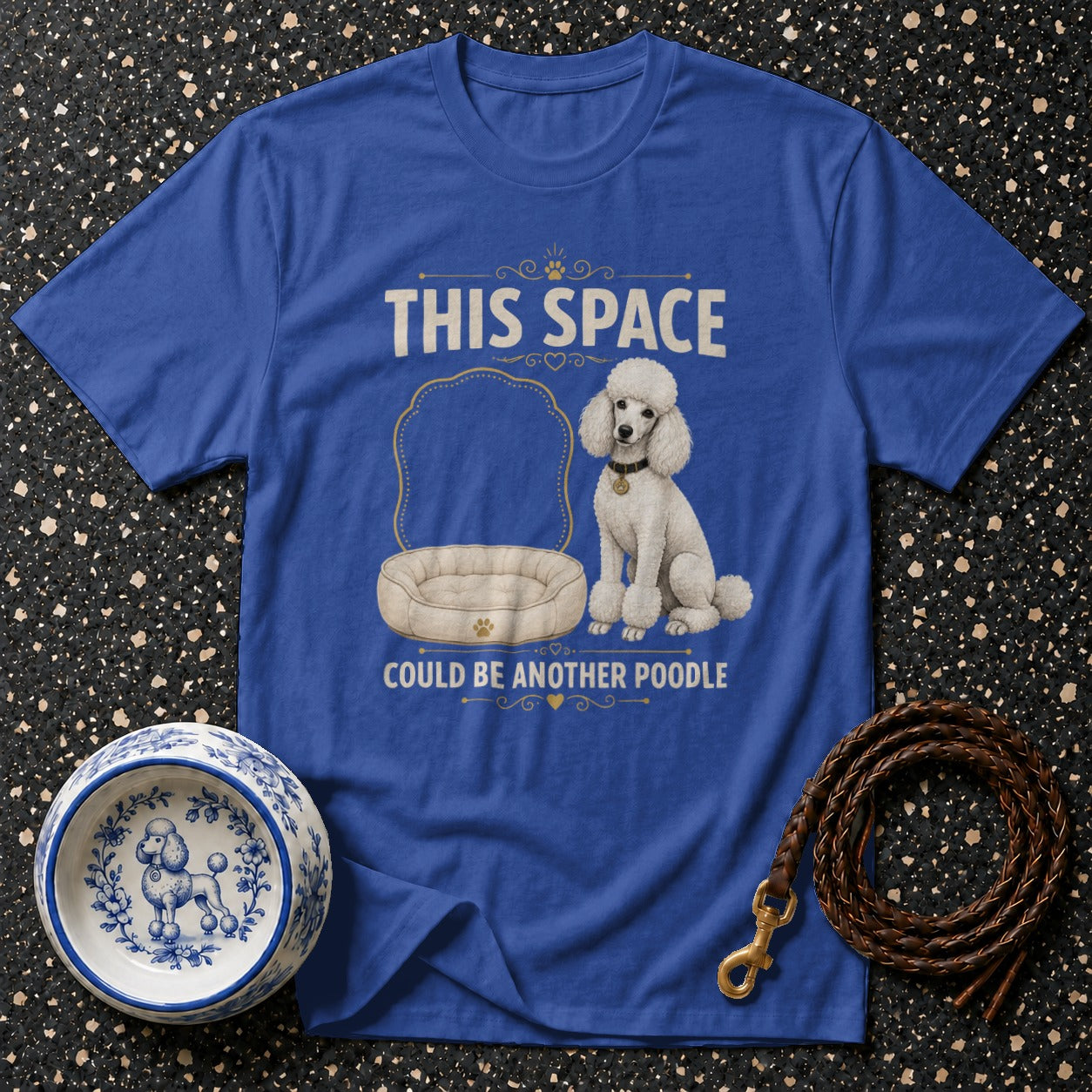 Royal blue t-shirt with a white poodle, dog bed, and text "THIS SPACE COULD BE ANOTHER POODLE."