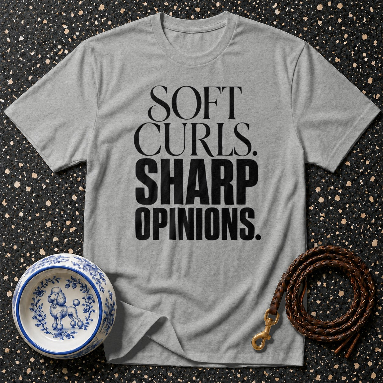 Grey t-shirt with "SOFT CURLS. SHARP OPINIONS." text and poodle-themed dog bowl.