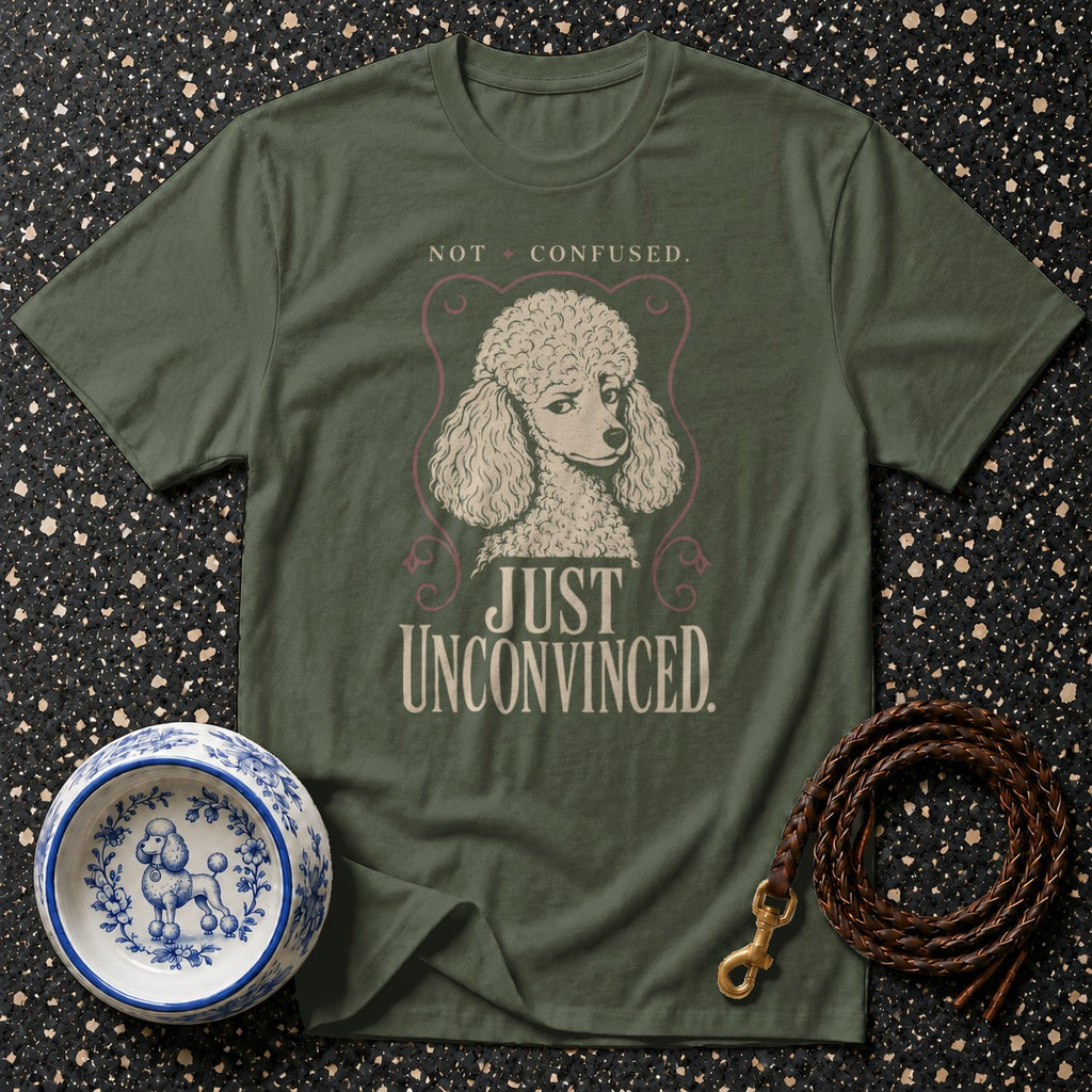 Green t-shirt with poodle graphic and text "NOT CONFUSED. JUST UNCONVINCED."