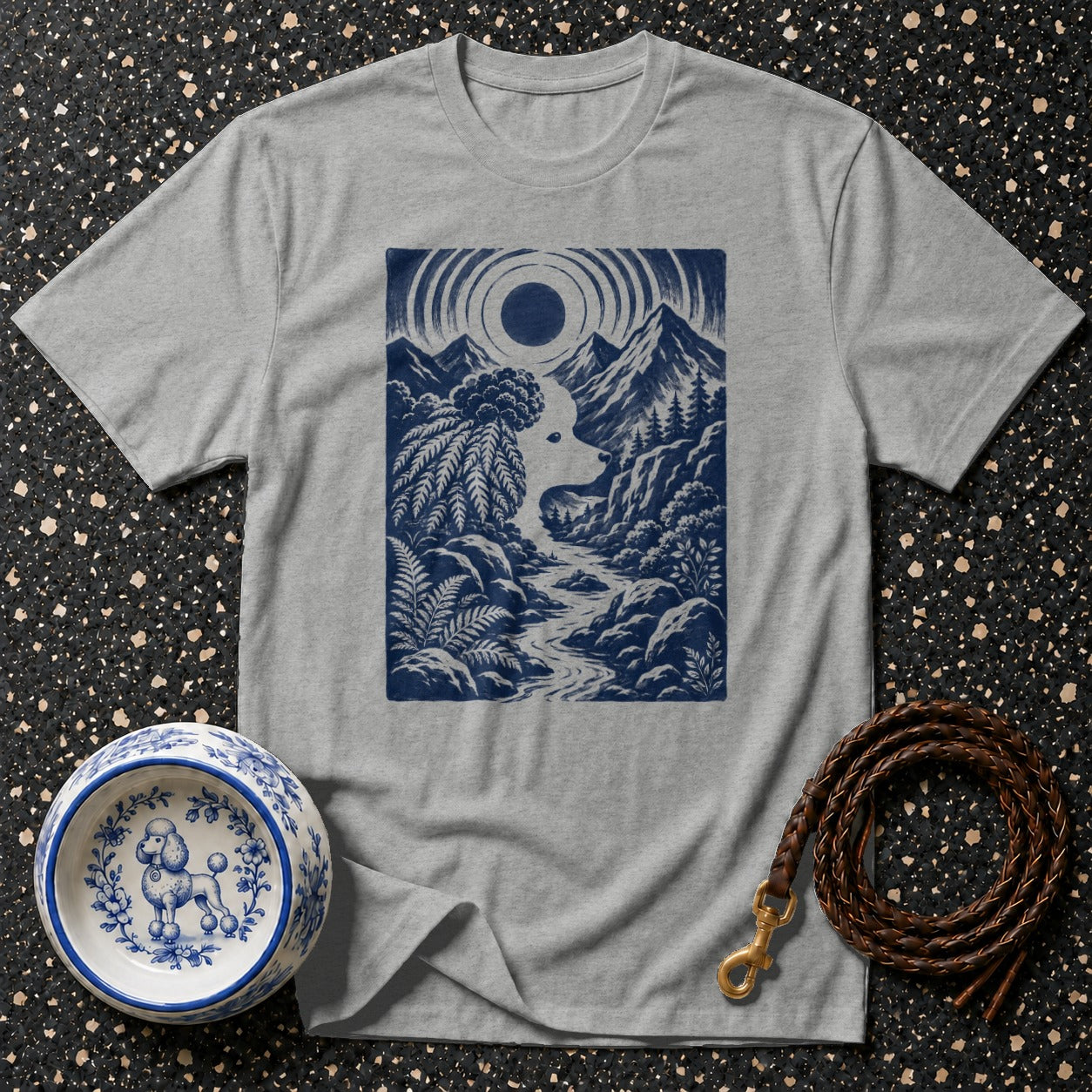 Gray t-shirt with a blue graphic of a poodle's head in a mountain landscape.