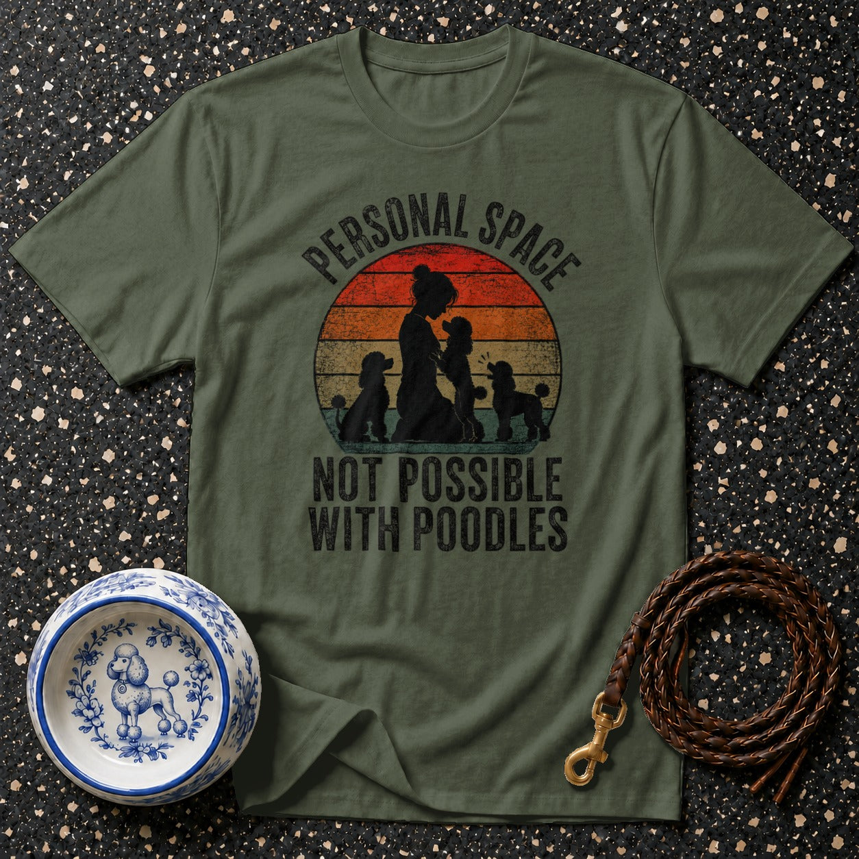 Green t-shirt with "Personal Space Not Possible With Poodles" slogan featuring poodles and a sunset graphic.