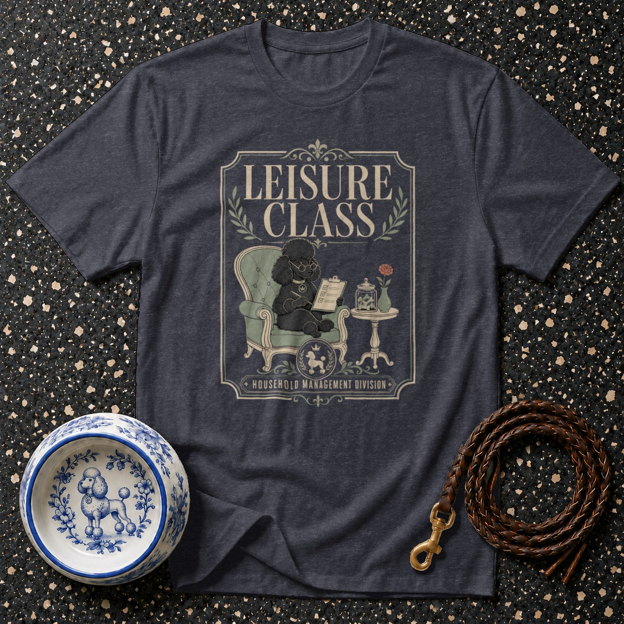 Dark grey t-shirt with "LEISURE CLASS Household Management Division" print featuring a poodle.