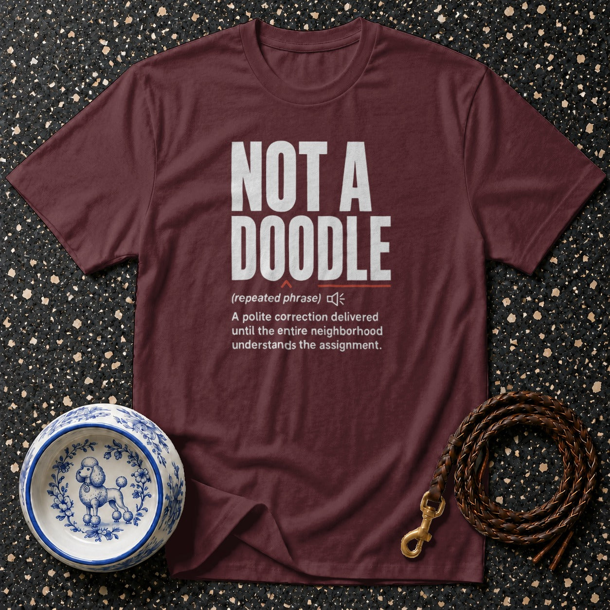 Maroon t-shirt with "NOT A DOODLE" and definition from an owl.