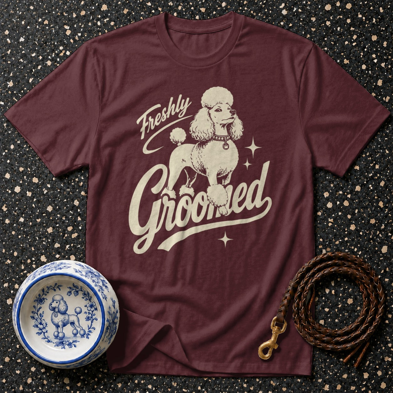 Maroon t-shirt with "Freshly Groomed" text and a poodle graphic.