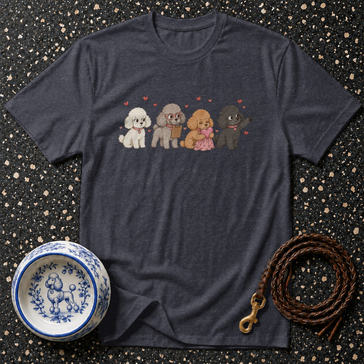 Dark heather grey t-shirt features a cartoon print of four poodles and hearts.
