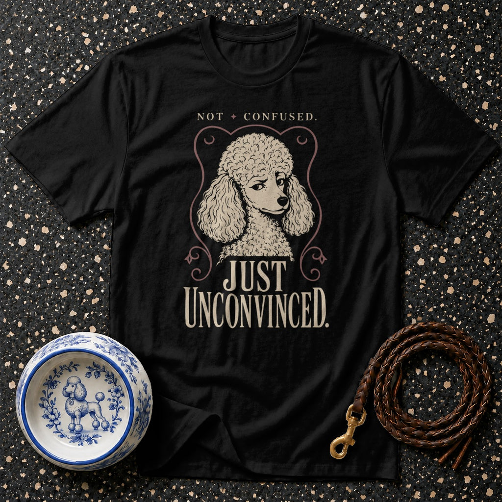 Black t-shirt with poodle graphic and text "NOT CONFUSED. JUST UNCONVINCED."