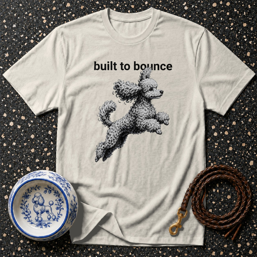 T-shirt with "built to bounce" text and a jumping poodle graphic.