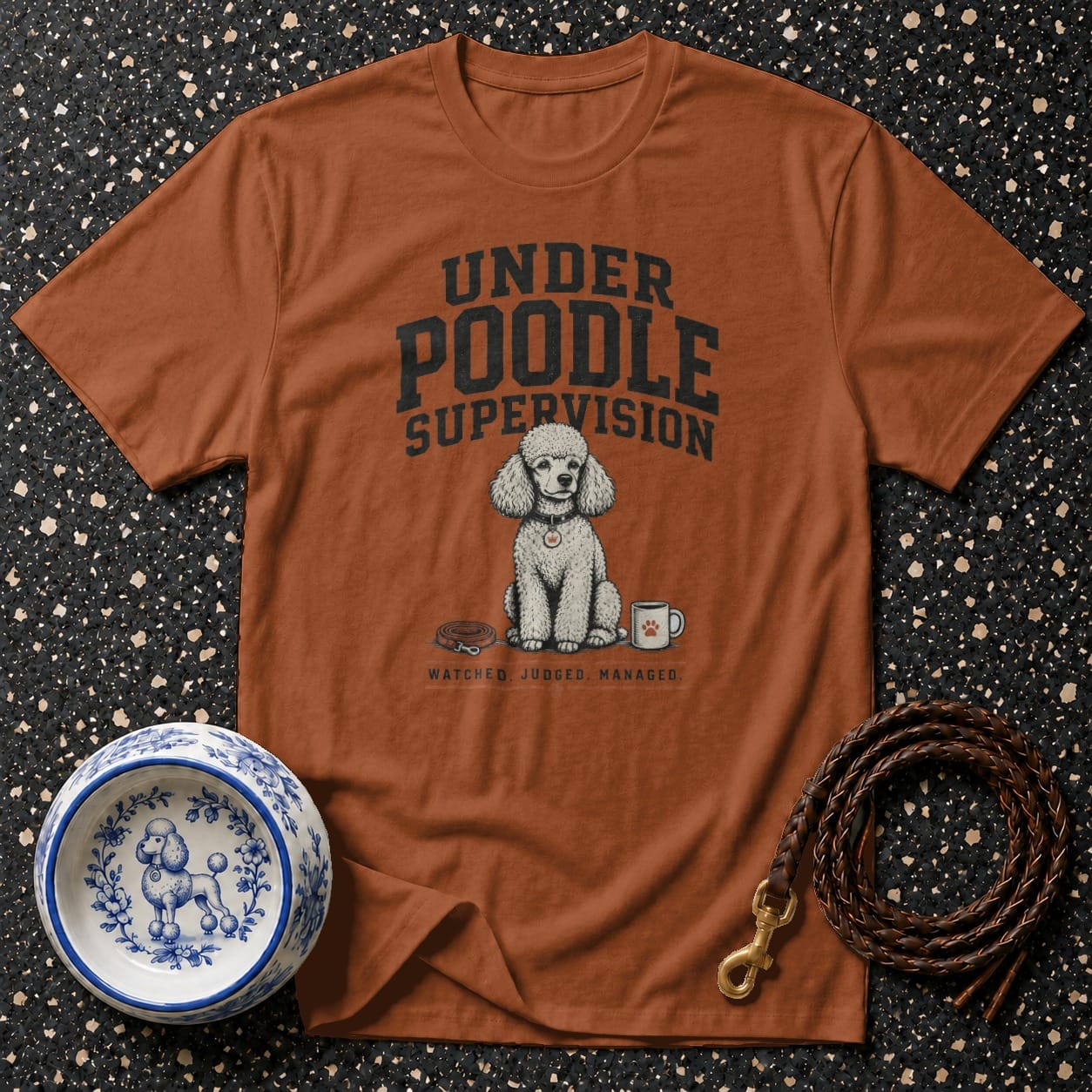 T-shirt with "Under Poodle Supervision" text and cartoon drawing of a poodle.