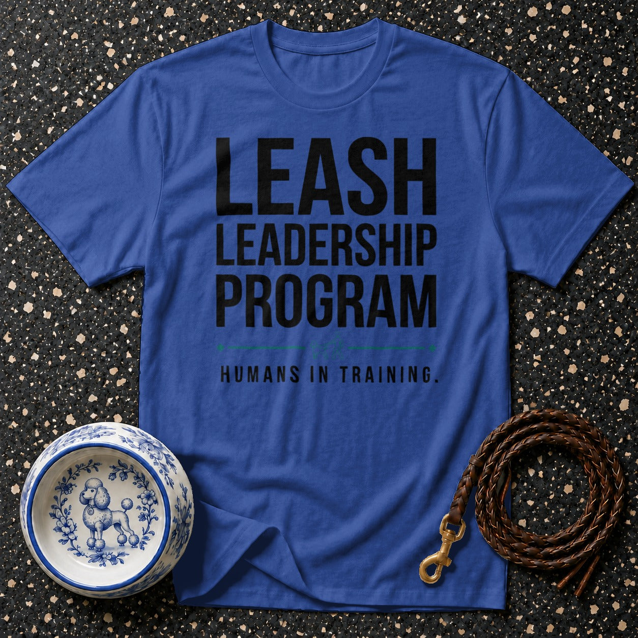 Royal blue t-shirt with "LEASH LEADERSHIP PROGRAM HUMANS IN TRAINING" text.