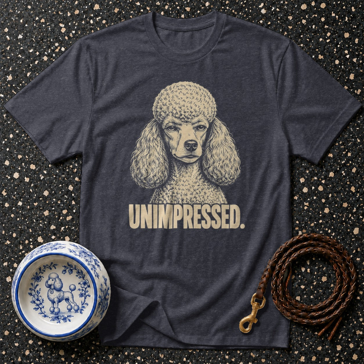 T-shirt with a poodle graphic and the text "UNIMPRESSED."
