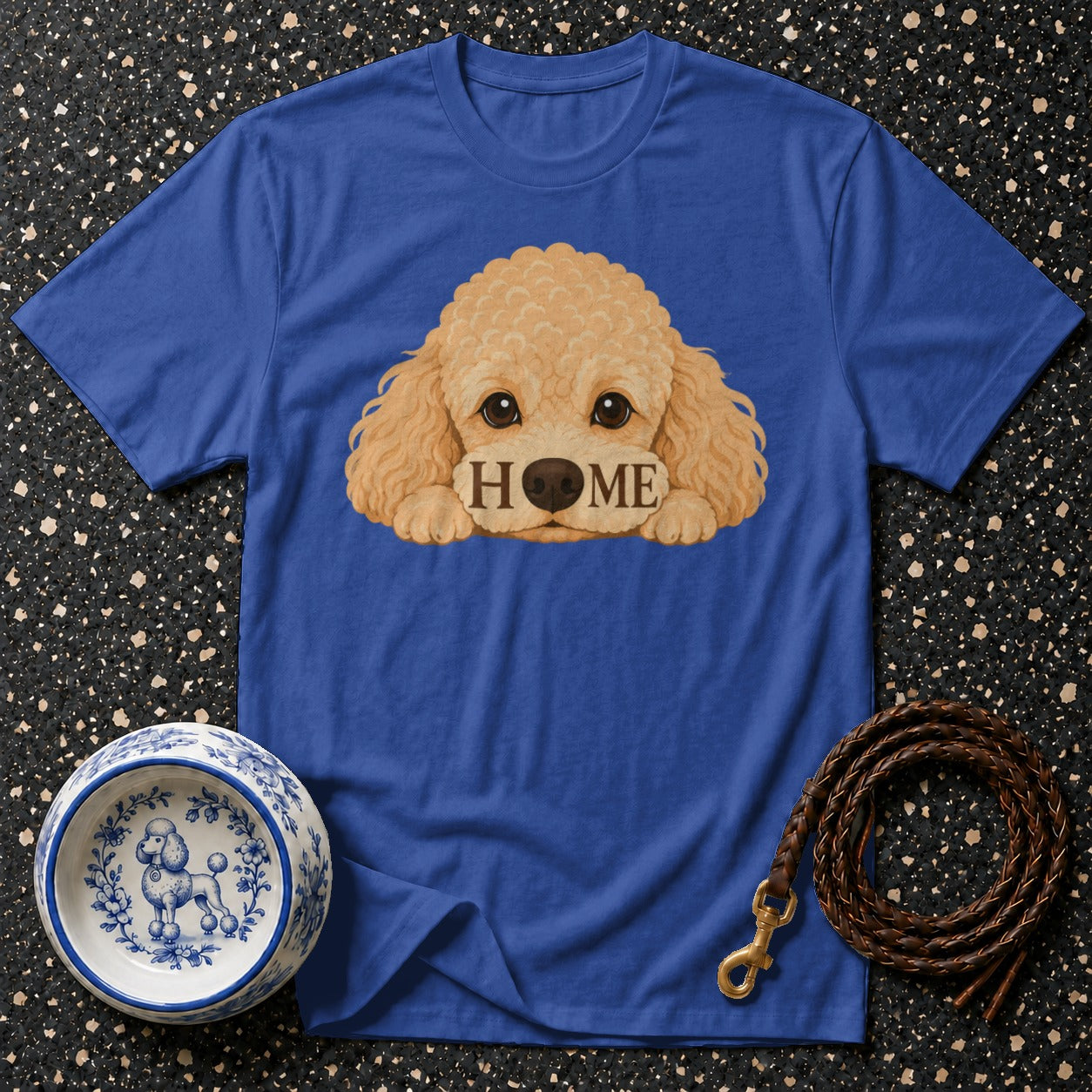 Blue t-shirt with a cartoon dog's face that says "HOME"