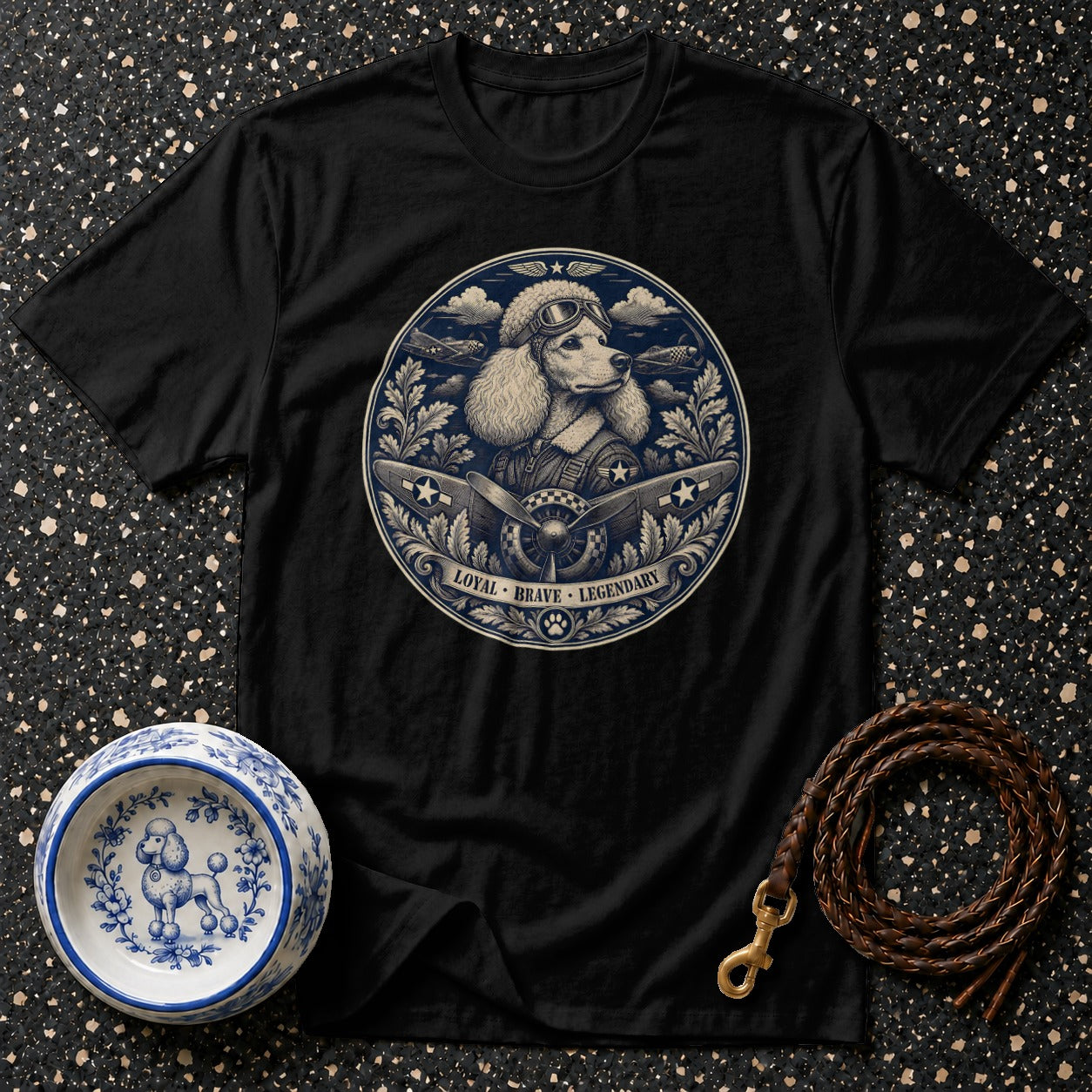 Black t-shirt with a poodle pilot graphic reading "Loyal Brave Legendary".