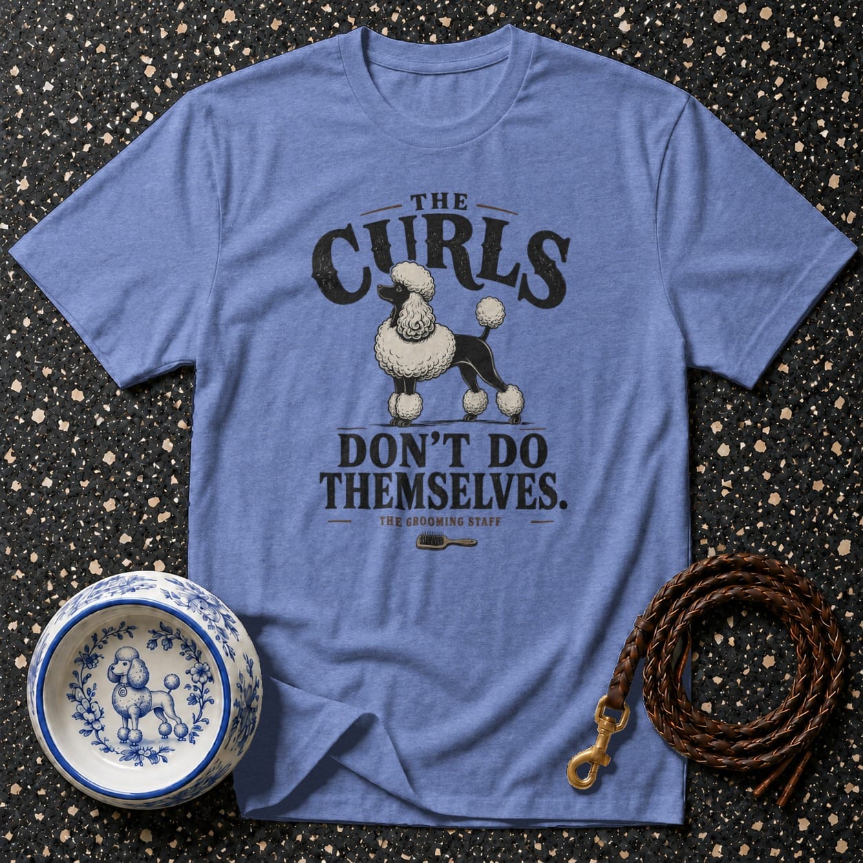 Blue t-shirt with a poodle graphic and text: "THE CURLS DON'T DO THEMSELVES."