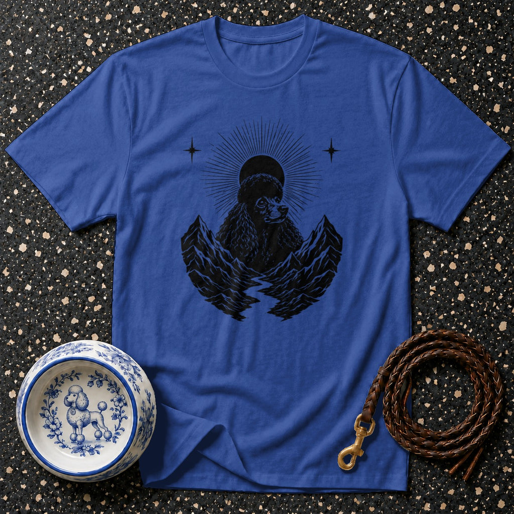 Blue t-shirt with black poodle, mountains, and sun graphic.