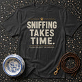 Dark grey t-shirt with text "SNIFFING TAKES TIME. PLEASE RESPECT THE PROCESS."