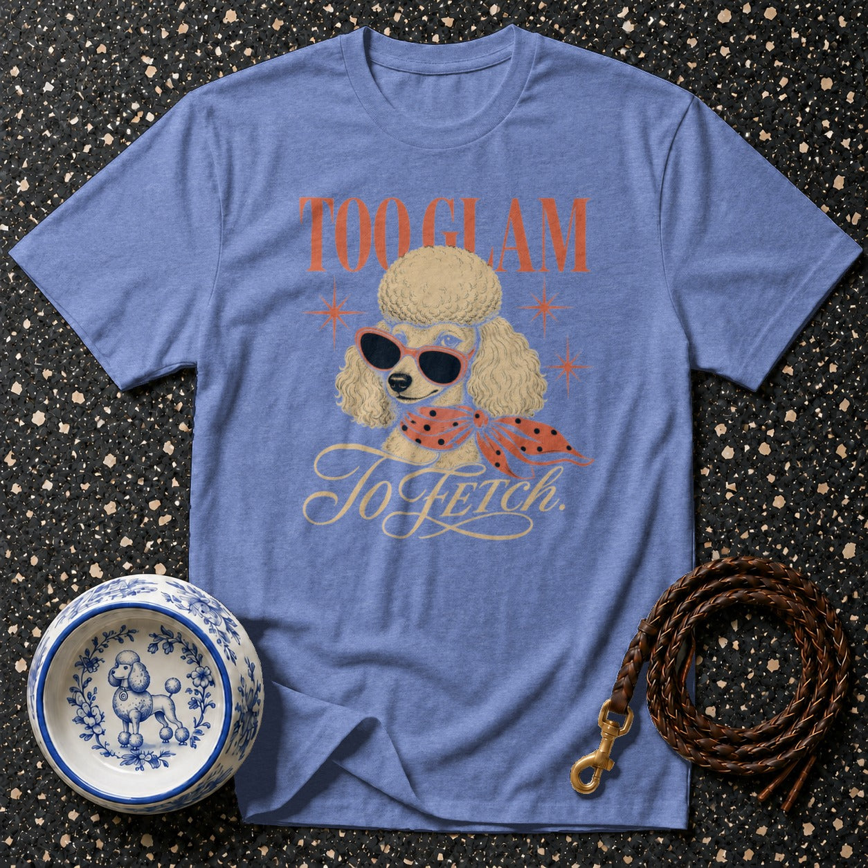 Blue t-shirt with a poodle graphic wearing sunglasses and text "Too Glam To Fetch".