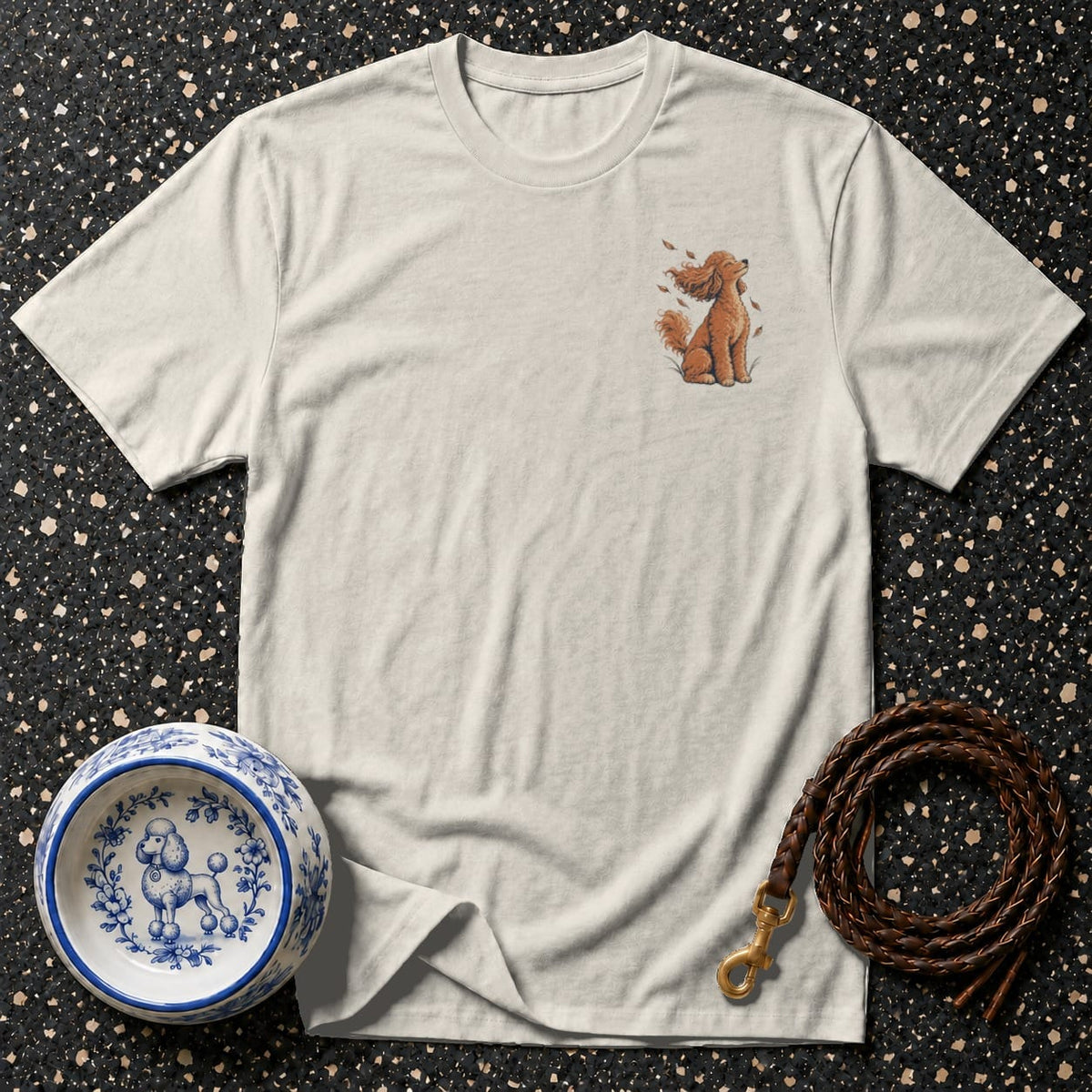 Light grey t-shirt with a small embroidered poodle graphic on the left chest.
